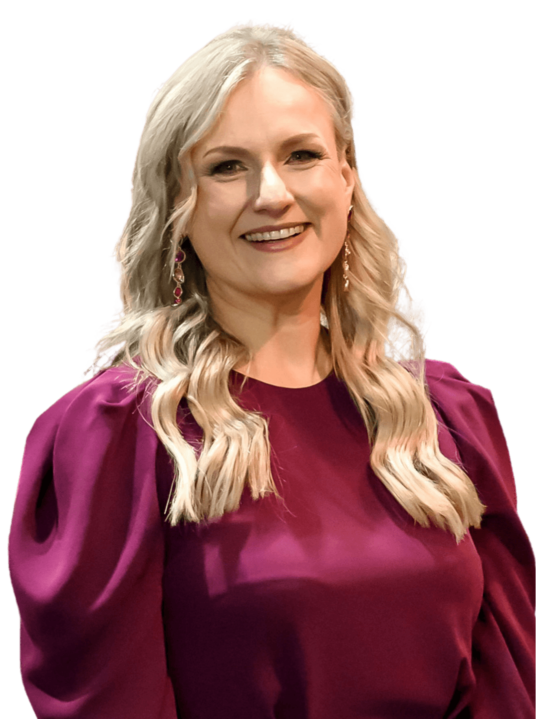 Nina Christian standing in a burgundy dress