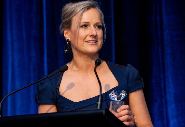 Nina Christian accepting an award at the 2018 AMI Awards for Marketing Excellence